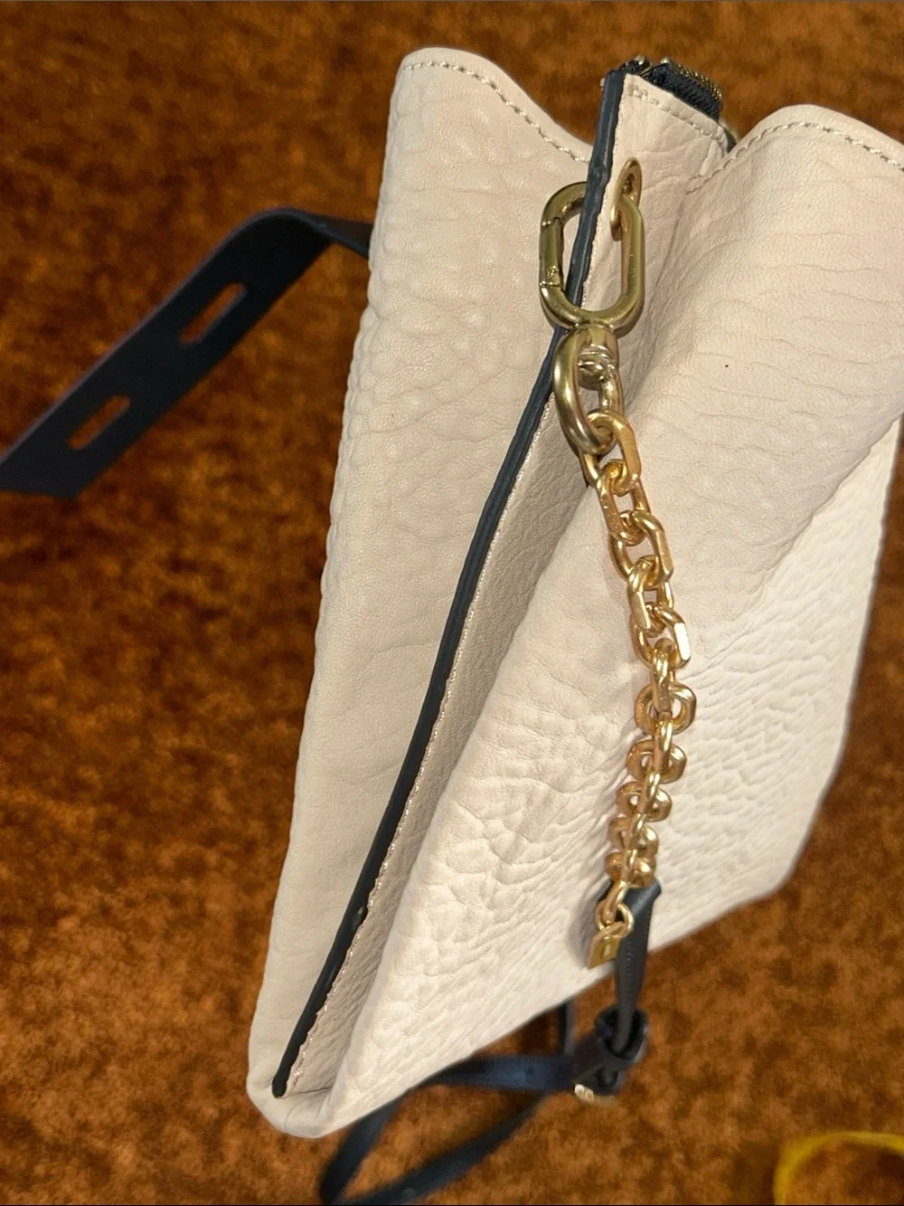 Cream Crossbody Bag with Black Strap and Gold Chain Accent